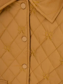 Ruffled Cap Sleeve Tiny Bow Embroidered Quilted Front Snap Vest W/ Pockets | S-L -Discount Divas Shop 25449c6eef3224eb2b47a5d7e6d57f6c