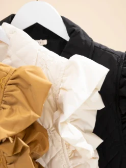 Ruffled Cap Sleeve Tiny Bow Embroidered Quilted Front Snap Vest W/ Pockets | S-L -Discount Divas Shop 740495a3d3aeff9a8acde3abe5600f21